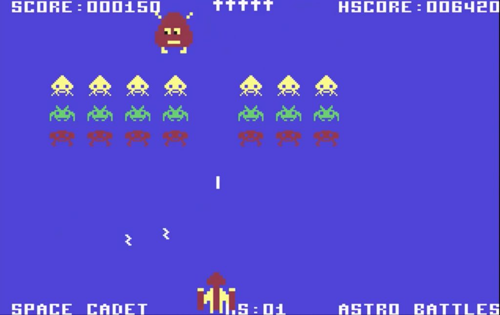 Gorf on the Commodore 64: the Astro Battles mission with rows of invaders and the Gorfian robot at the top