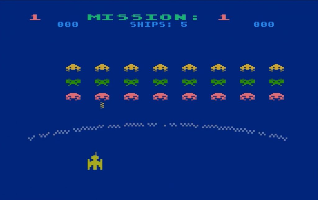 Gorf on the Atari 800: mission 1, rows of invaders above a broken force field